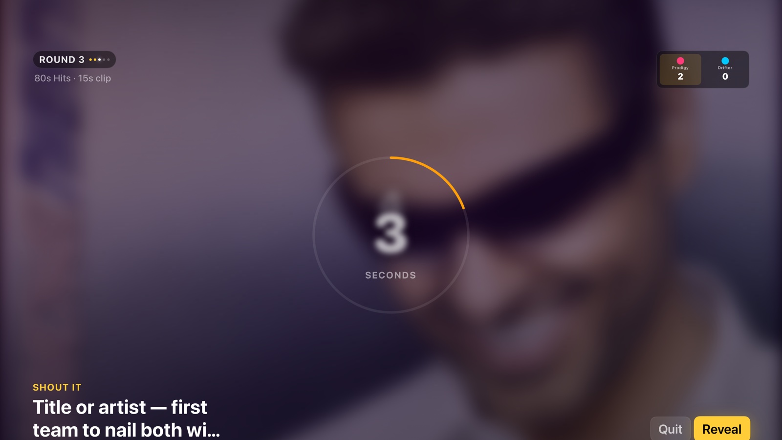ShoutTrack live round with blurred album art and countdown